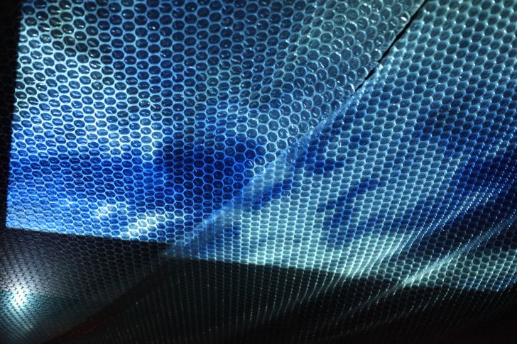 Bubble Wrap on a ceiling with blue lighting.