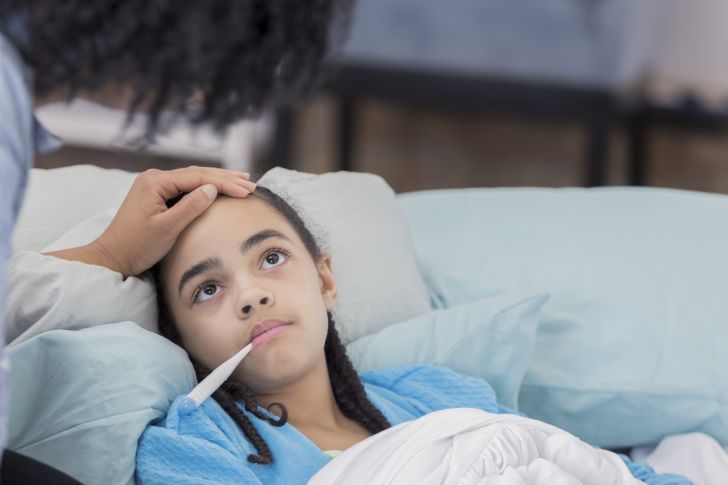 Mom takes care of sick daughter