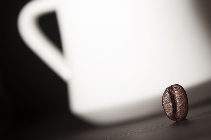 coffee bean next to mug