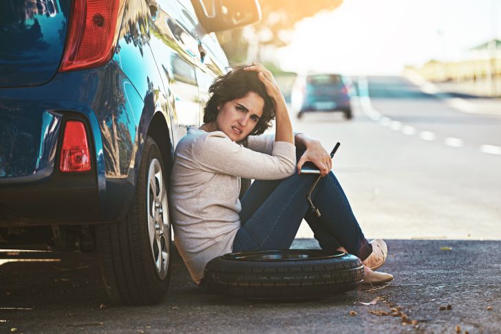 woman with broken down car