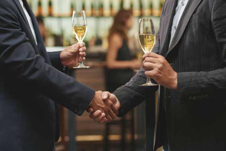 men in suits shaking hands