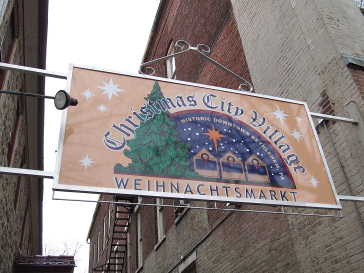 A sign reads 'Christmas City Village Weihnachtsmarkt.'
