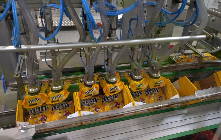 A machine packaging M&M's candies at a Mars factory in France.