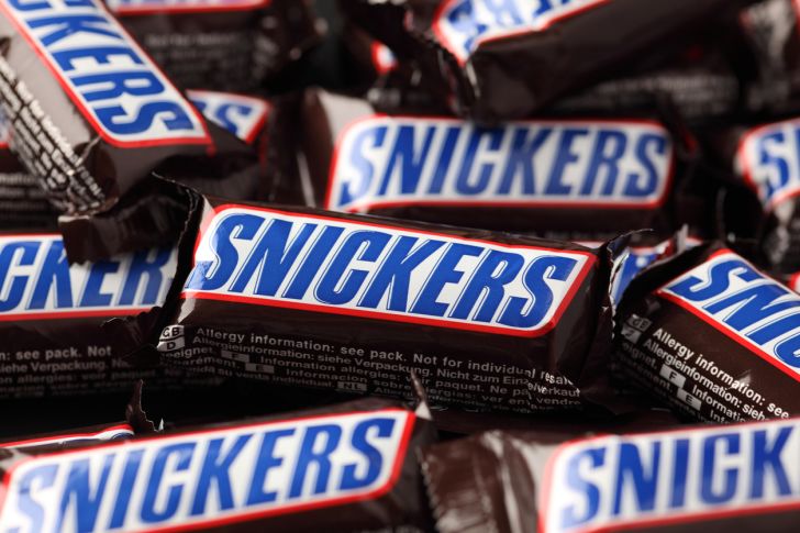Snickers bars piled up on each other.