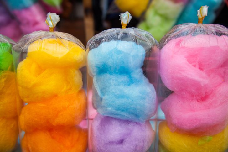 Bags of brightly colored cotton candy in various hues.