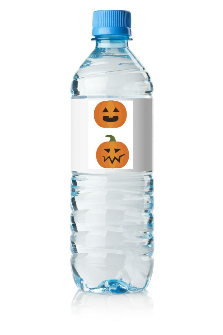 A water bottle features a decorative Halloween label