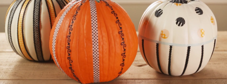 Pumpkins that have been decorated using tape