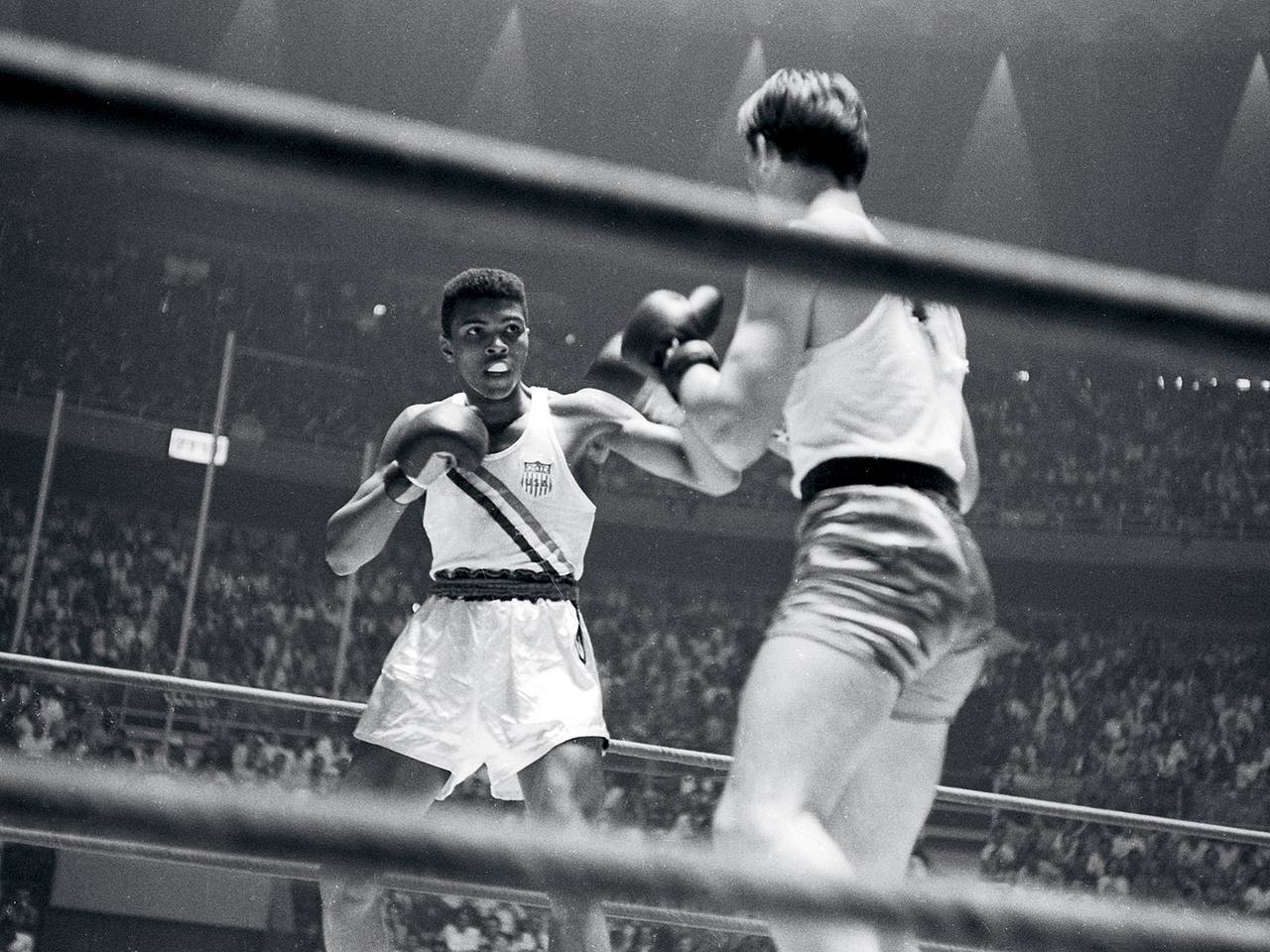 Cassius Clay lands a jab at the 1960 Rome Olympics