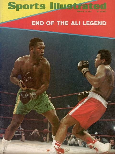 SI cover, March 15, 1971: "End of the Ali Legend." Joe Frazier, in green trunks, and Ali, in red trunks, face off during their first fight as ringside photographers watch.