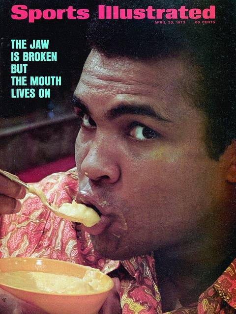 SI cover, April 23, 1973: "The Jaw Is Broken but the Mouth Lives On." Ali, in a patterned shirt, eats soft food from a bowl with a spoon while looking at the camera.