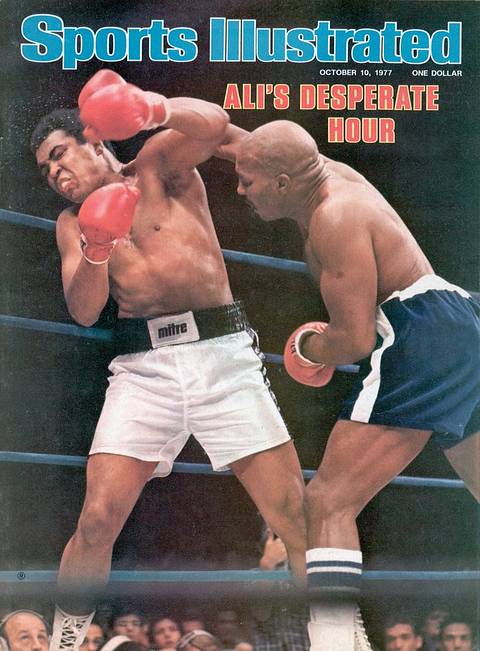 SI cover, October 10, 1977: "Ali's Desperate Hour." Ali covers up against the ropes as Earnie Shavers lands a right to his head.