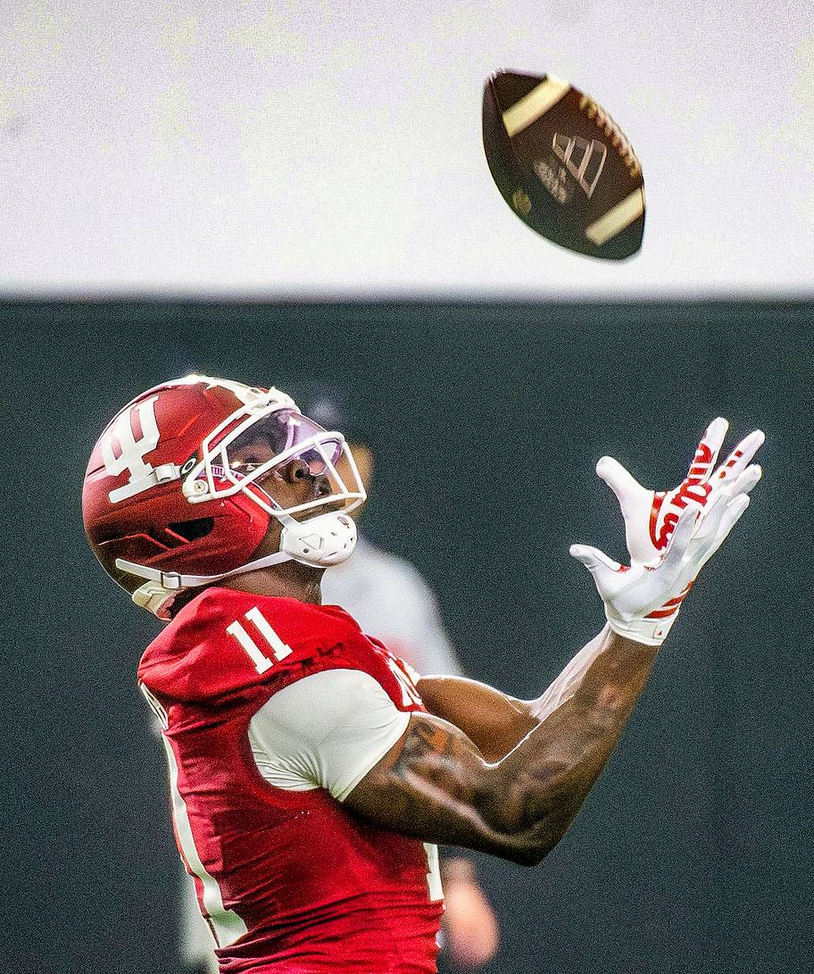 Nick Marsh holds his hands open to catch a pass.