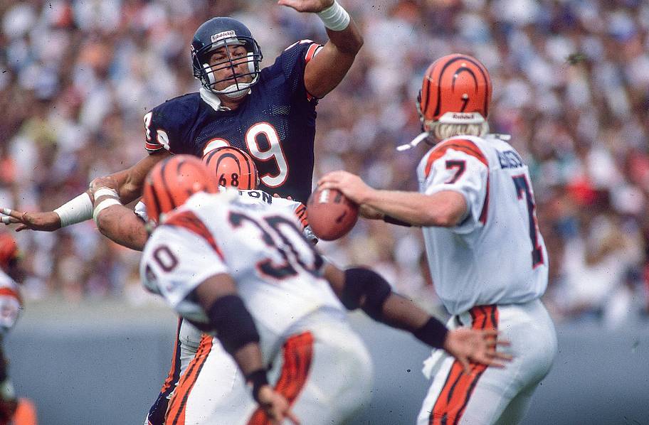 Dan Hampton raises his arms to block a throwing lane against the Bengals