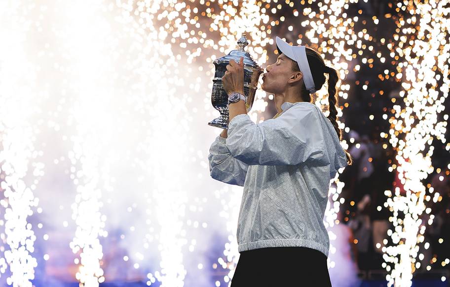 Kazakhstan's Elena Rybakina celebrates with the winner's trophy after her final match against Belarus' Aryna Sabalenka.