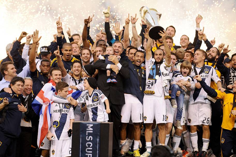 LA Galaxy's David Beckham celebrates with his team mates after winning the MLS Cup Final at the Home Depot Center, LA.