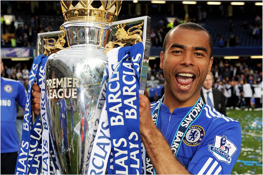 Ashley Cole holds aloft the Premier League trophy in 2010. 