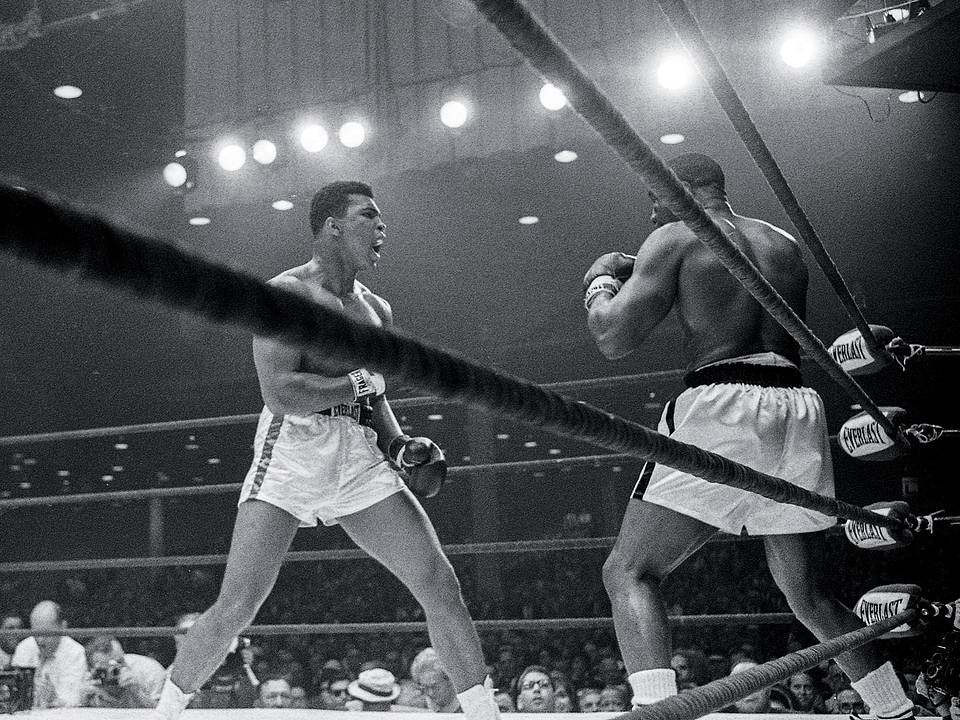 Ali on the ropes in his corner with his cornerman
