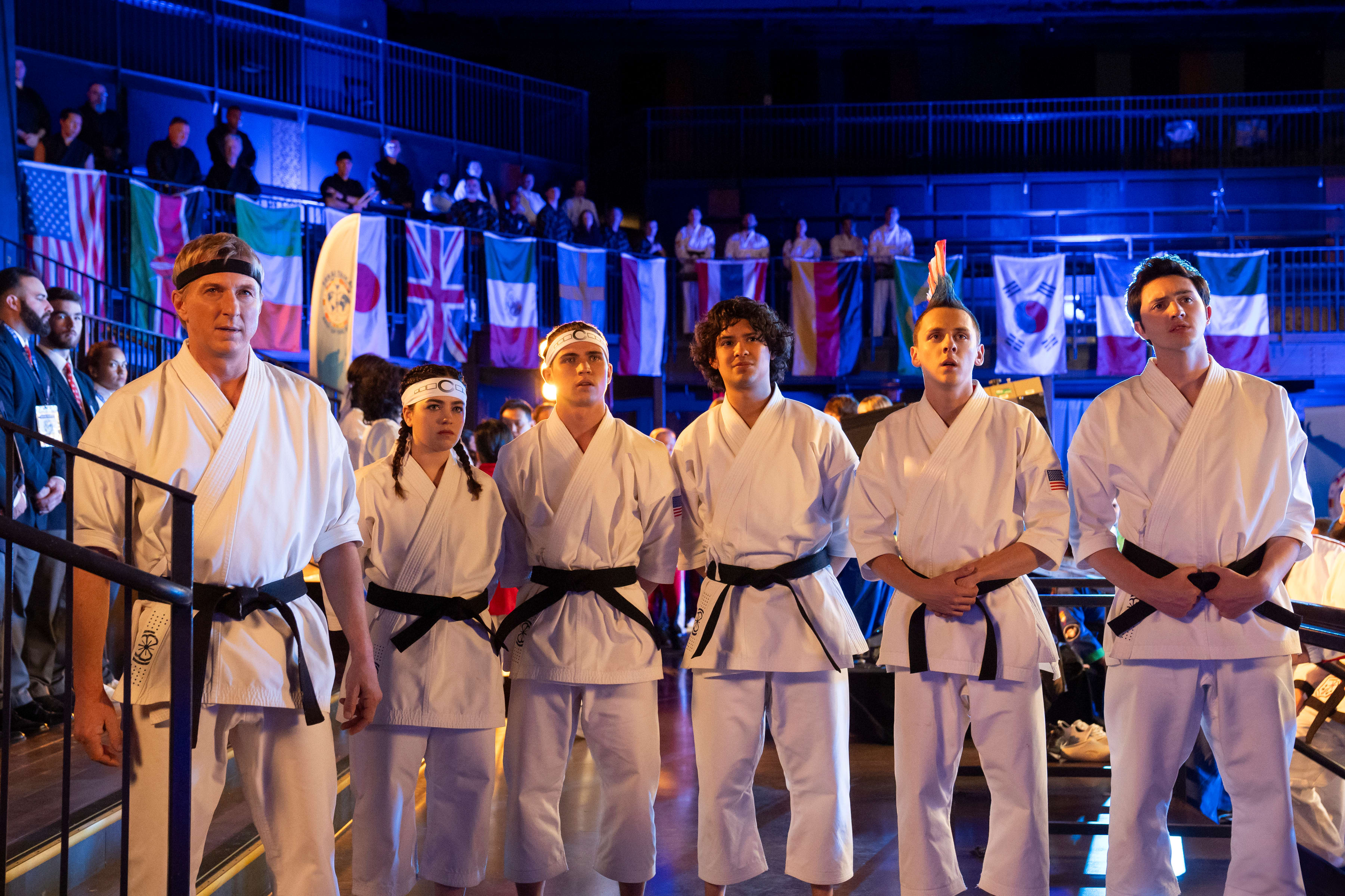 Johnny Lawrence stands with the students of his karate dojo at the Sekai Taikai.