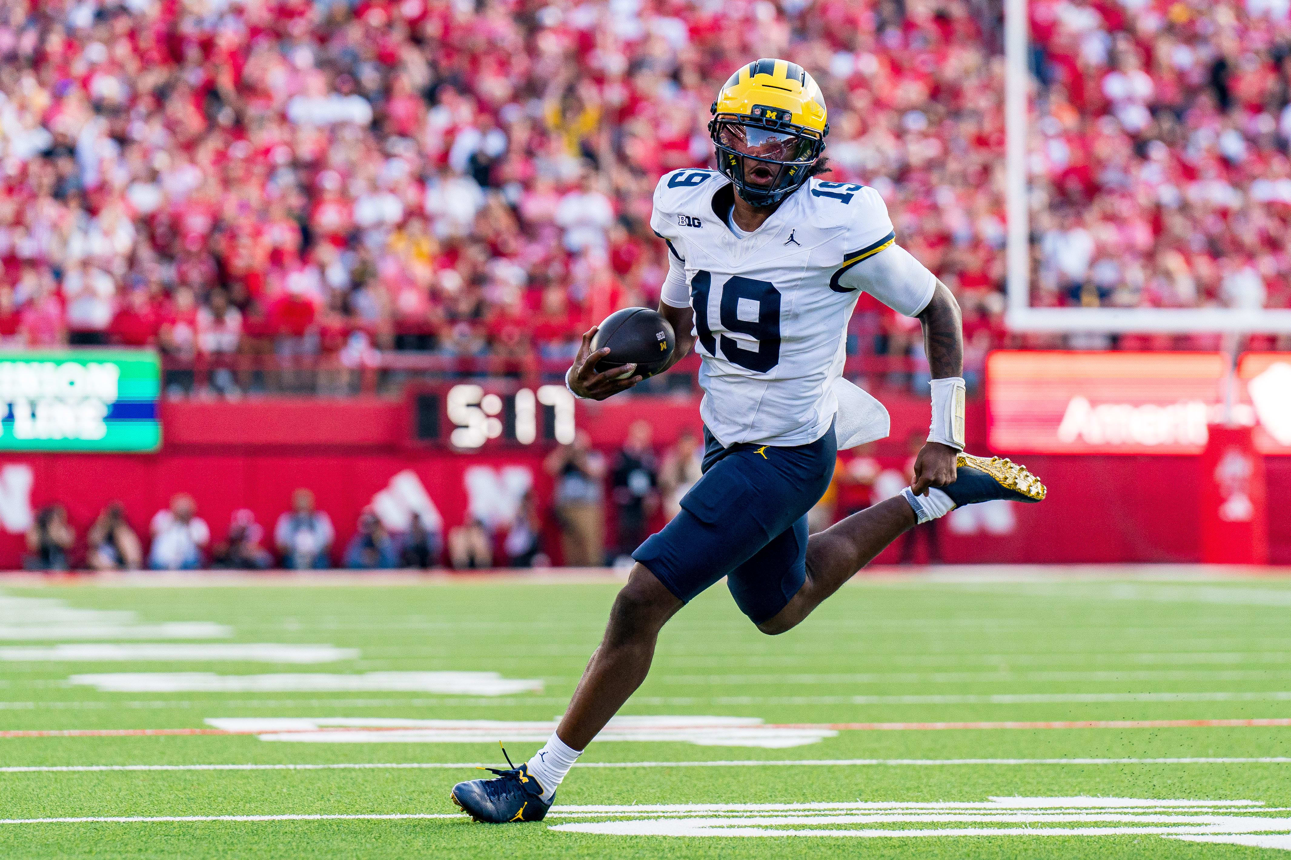 Michigan Wolverines quarterback Bryce Underwood runs against the Nebraska Cornhuskers.