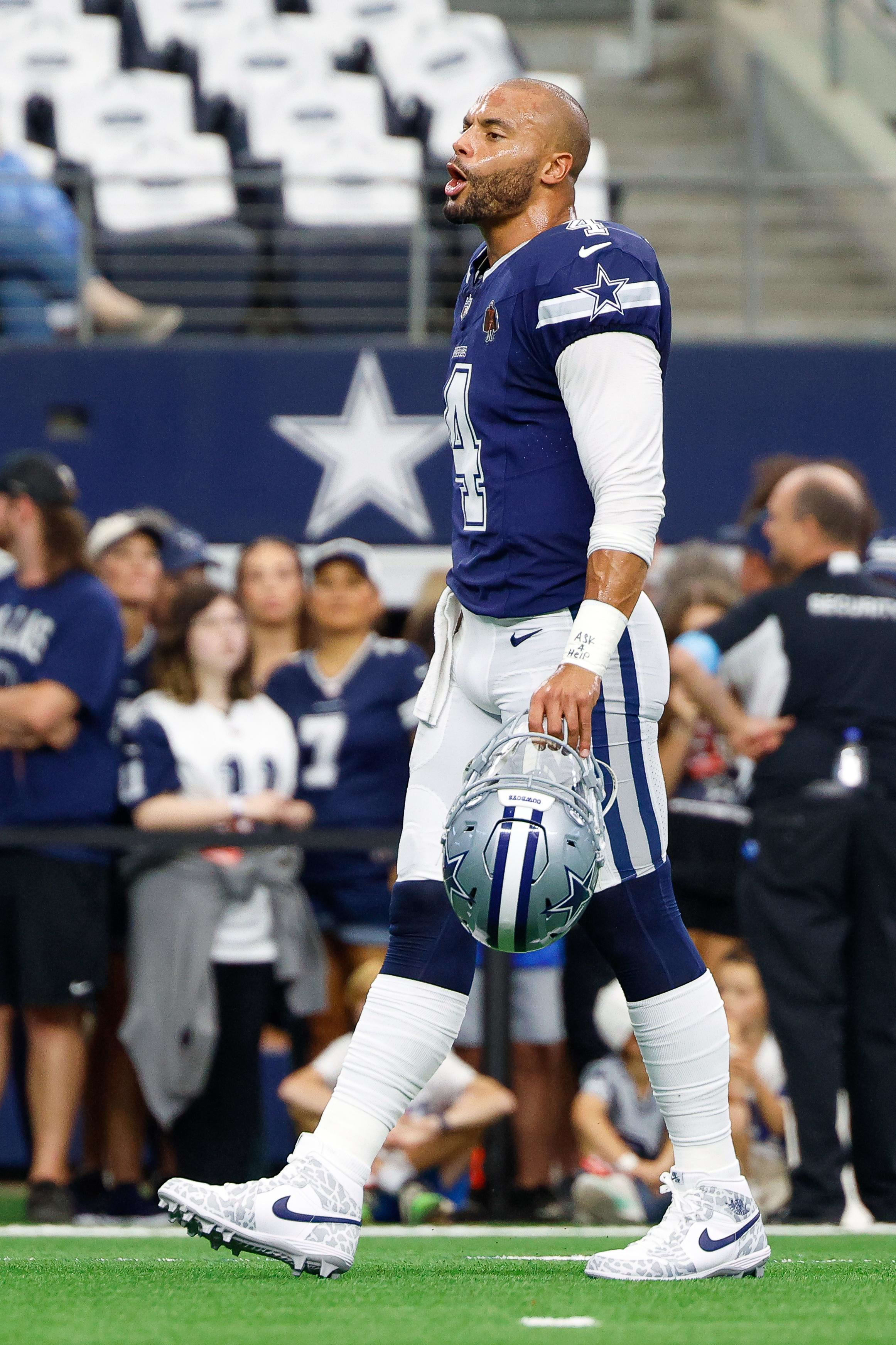 Dallas Cowboys quarterback Dak Prescott warms up prior to the game against the Detroit Lions.