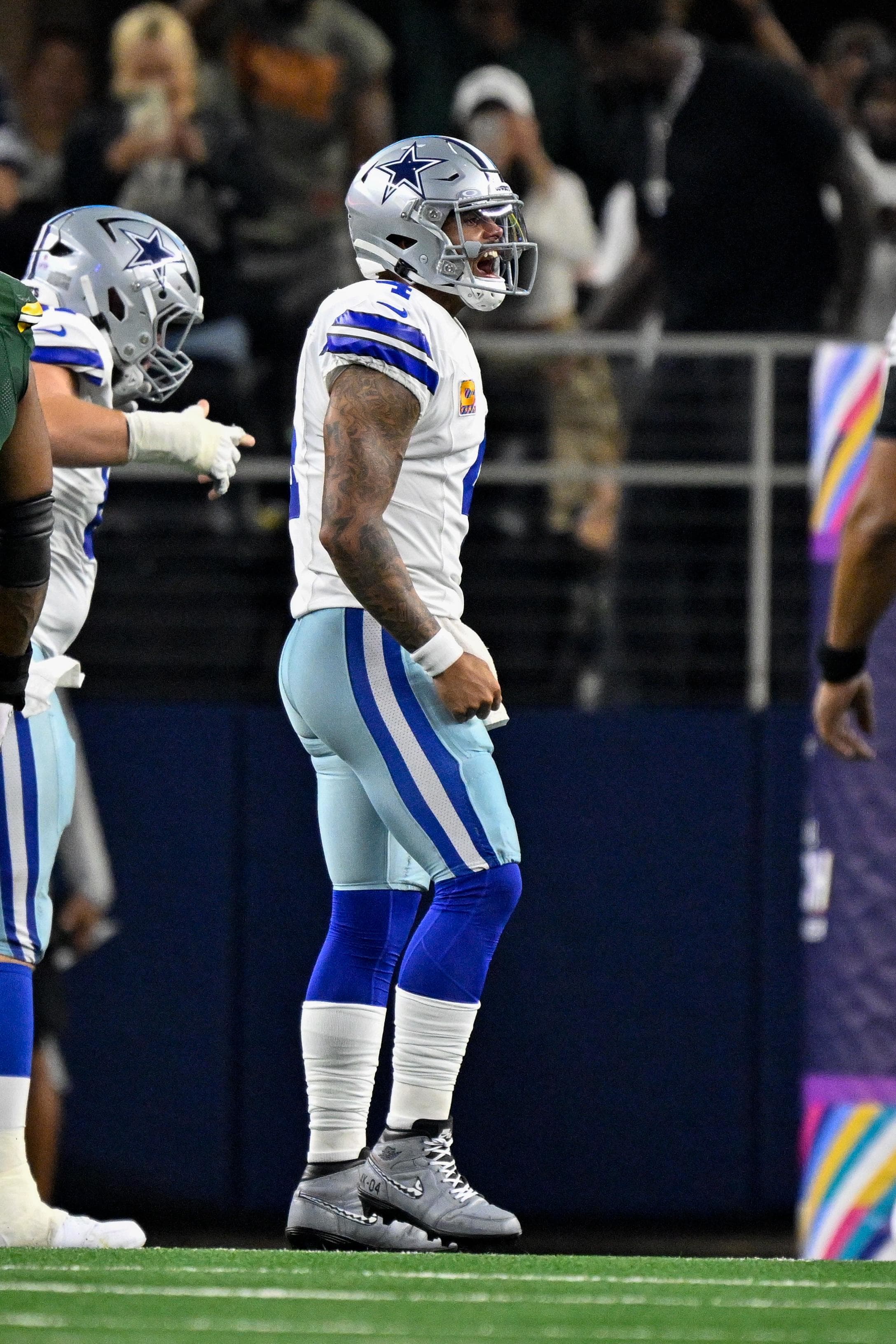 Dallas Cowboys quarterback Dak Prescott celebrates a touchdown against the Green Bay Packers at AT&T Stadium.