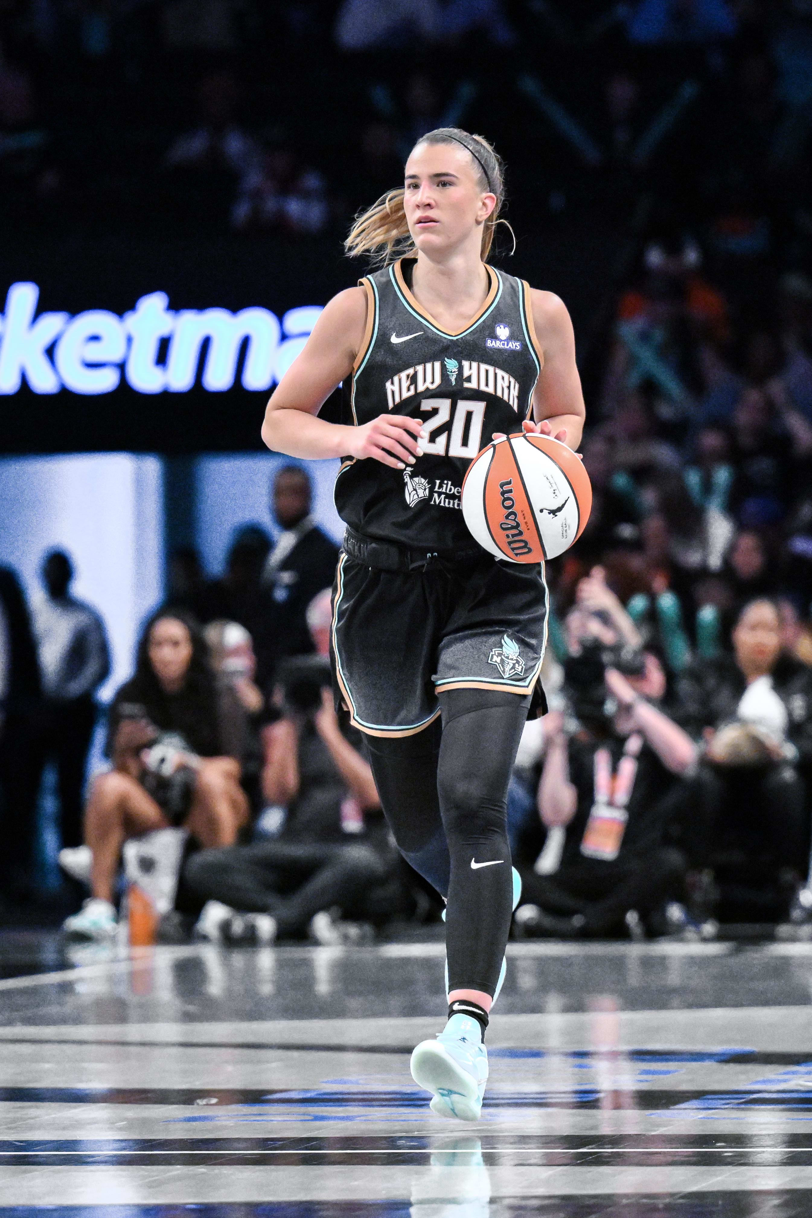 New York Liberty guard Sabrina Ionescu brings the ball up court against the Golden State Valkyries.