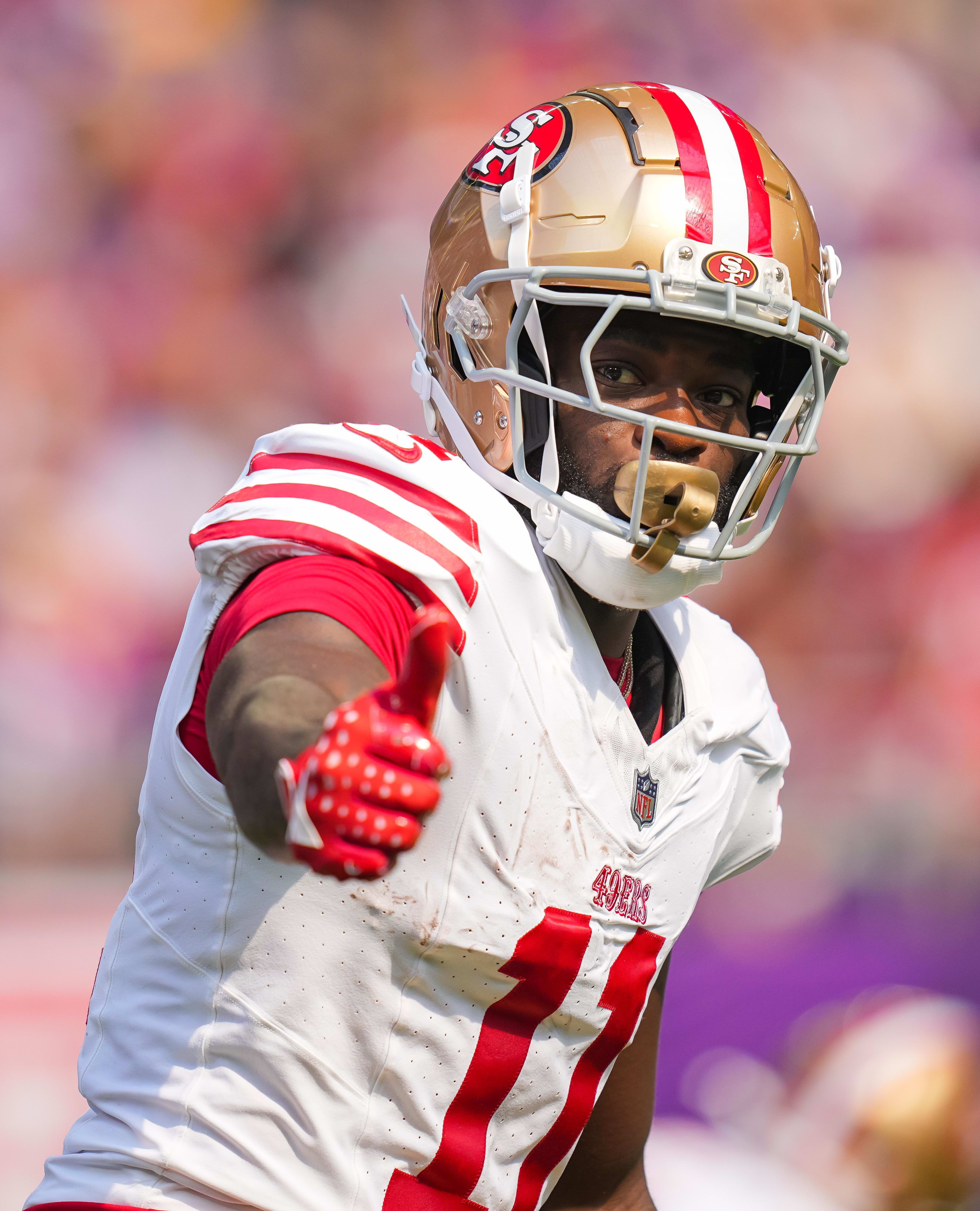 San Francisco 49ers wide receiver Brandon Aiyuk signals the referee against the Minnesota Vikings.