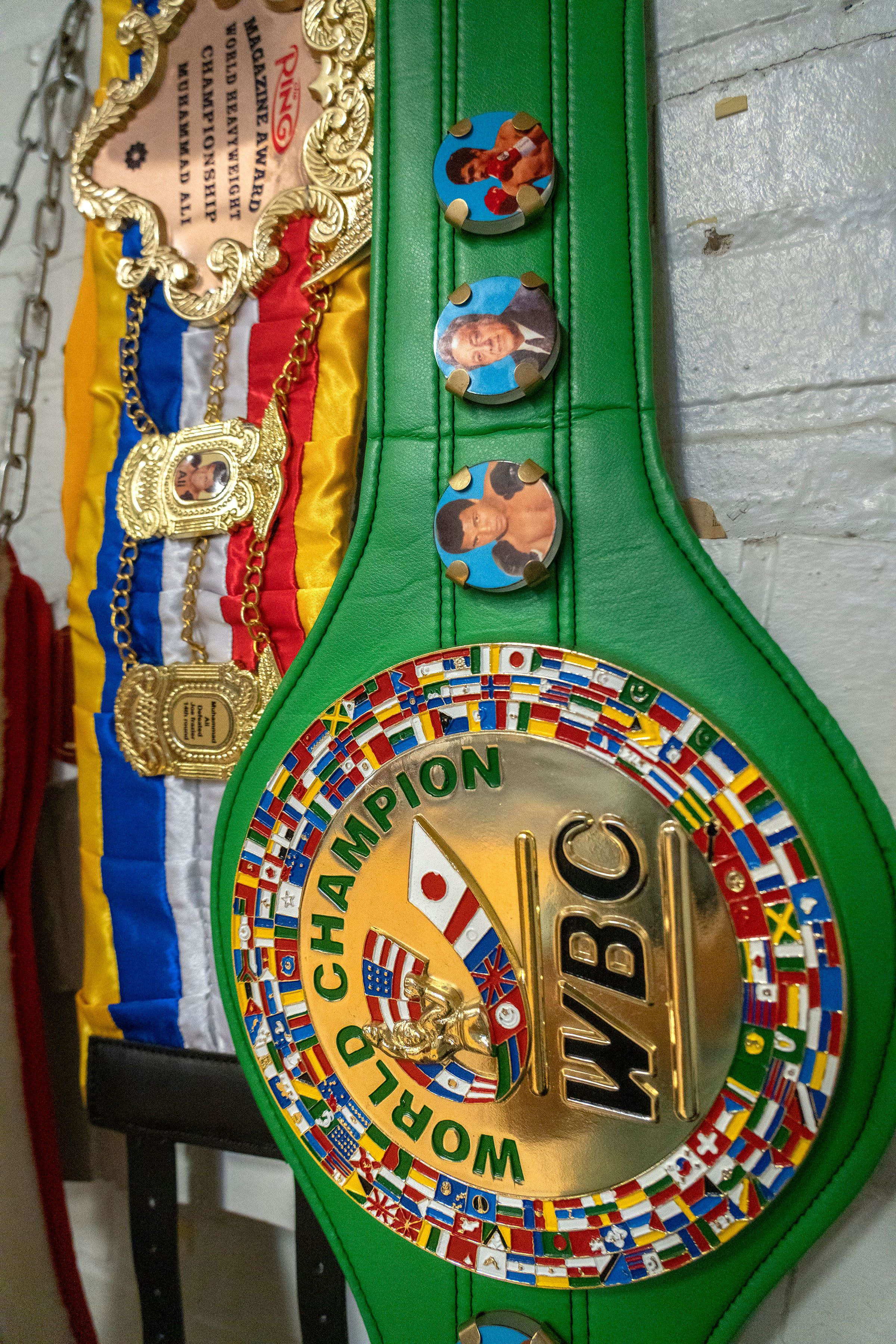 A WBC World Champion belt won by Head Boxing Coach Jeffrey Young hangs on the wall 