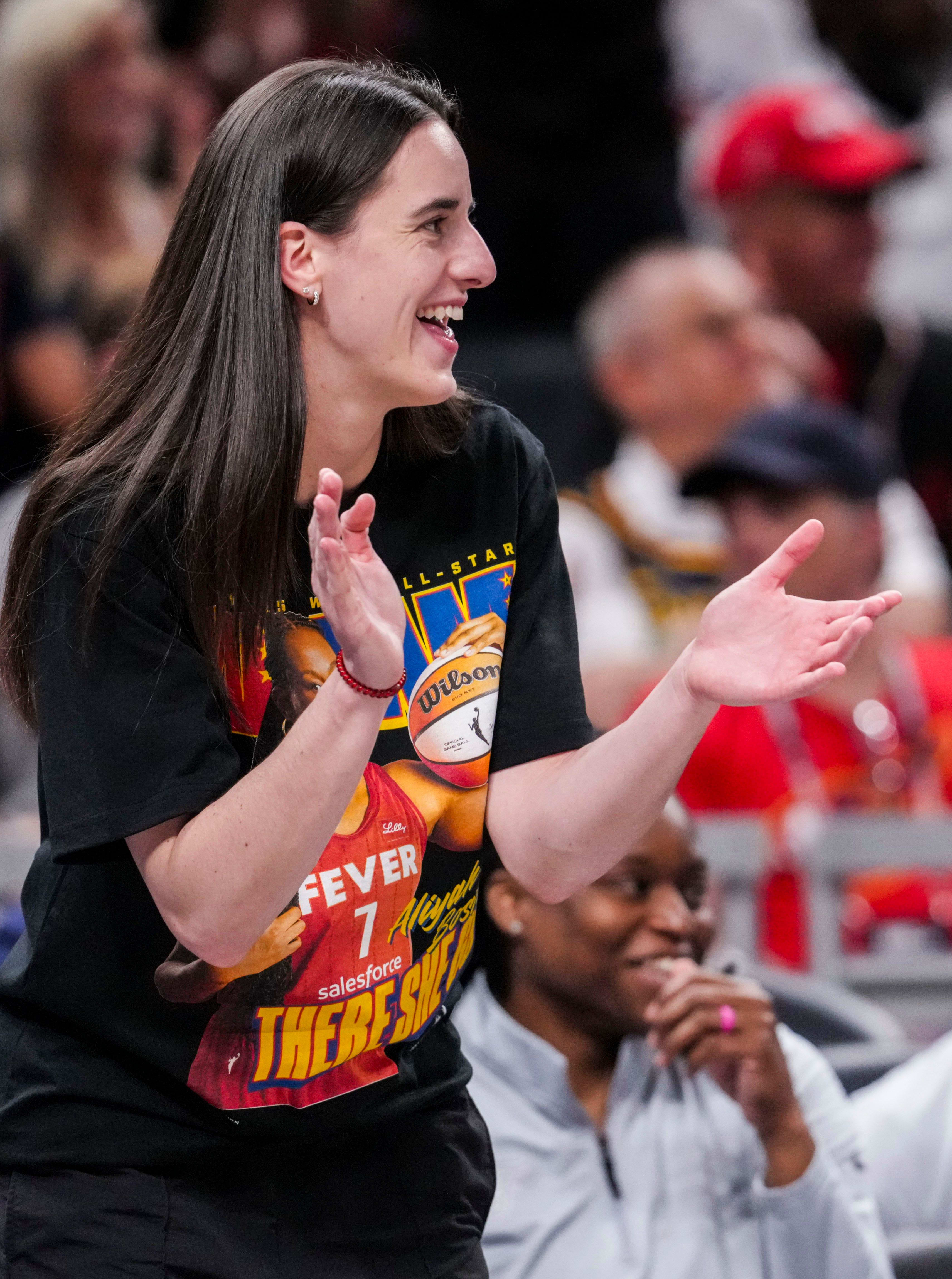 Indiana Fever guard Caitlin Clark cheers on Indiana Fever forward Aliyah Boston during a game against the Chicago Sky 