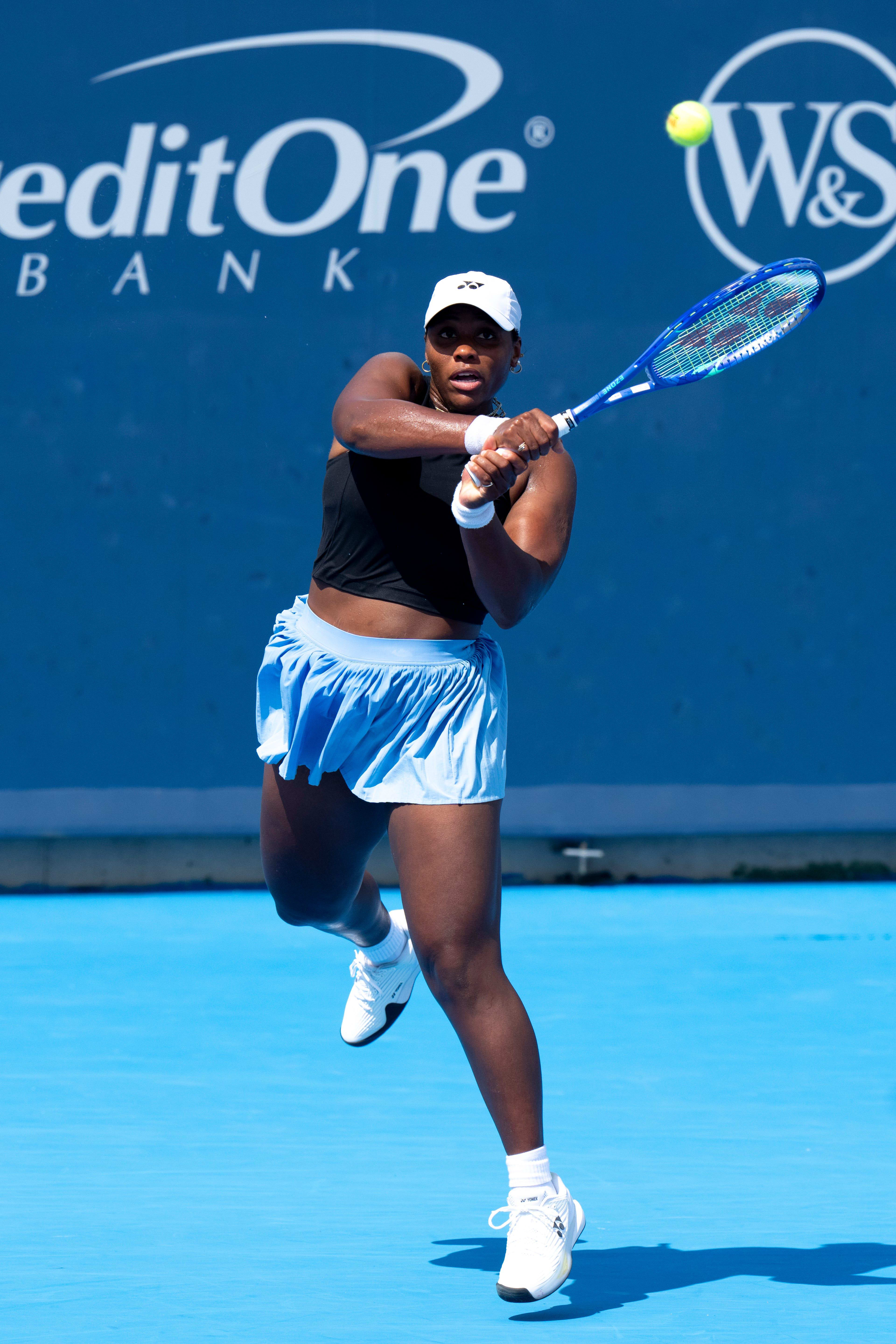 Taylor Townsend returns to Liudmila Samsonova, of Russia, during the Cincinnati Open at the Lindner Family Tennis Center