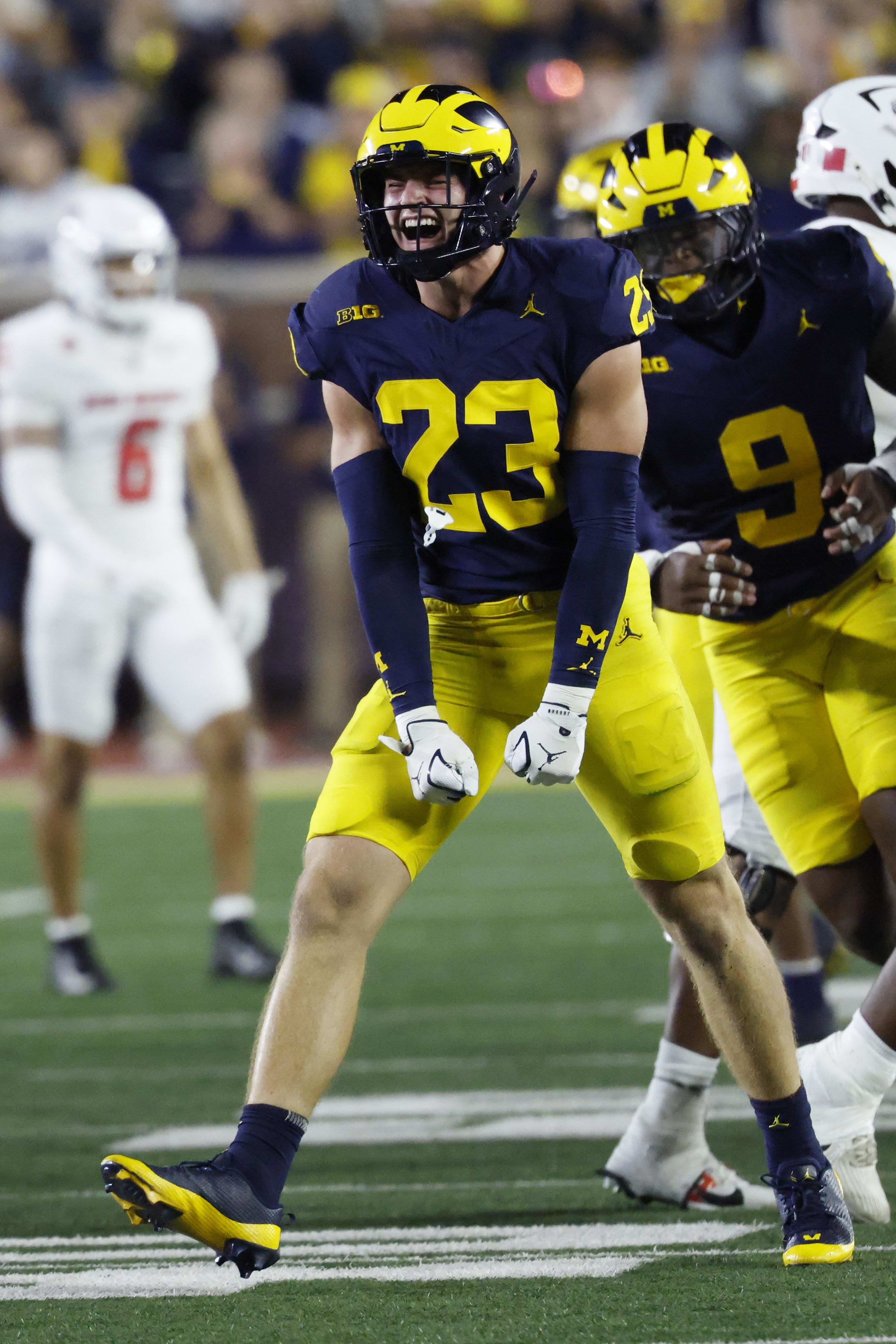 Michigan Wolverines linebacker Cole Sullivan celebrates after he sacks New Mexico Lobos quarterback Jack Layne in the second 