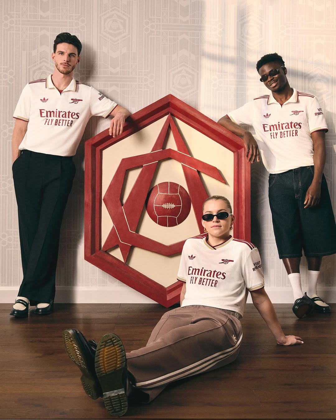 Declan Rice, Alessia Russo, and Bukayo Saka model Arsenal's new third kit.