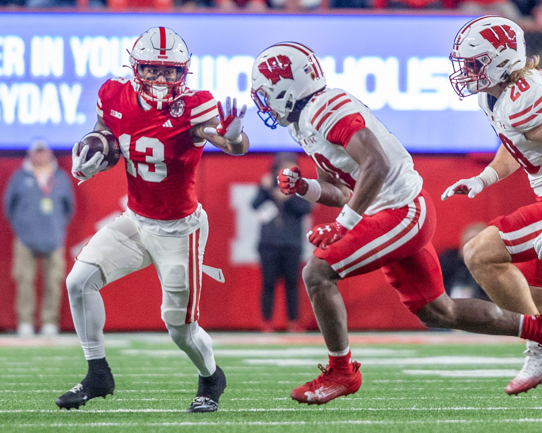 Nebraska wide receiver Isaiah Garcia-Castaneda gains ten yards on a pass from quarterback Dylan Raiola against Wisconsin.