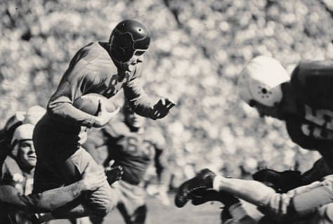 Minnesota halfback Harold Van Every carries the ball during Nebraska's upset win in 1937.