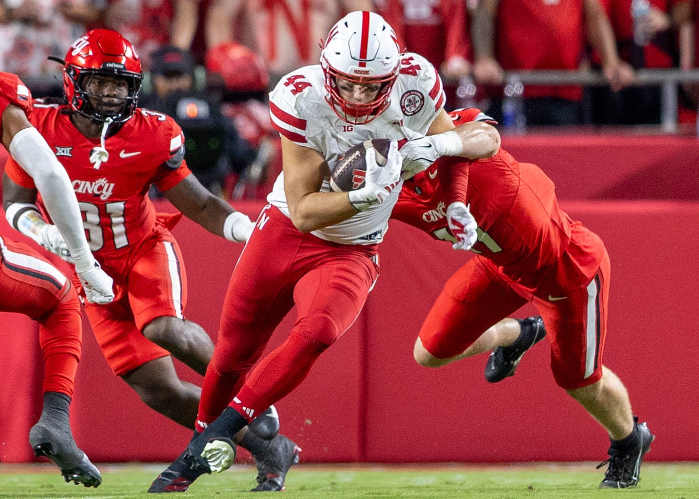 Nebraska tight end Luke Lindenmeyer fights for seven yards after a pass from quarterback Dylan Raiola against Cincinnati.
