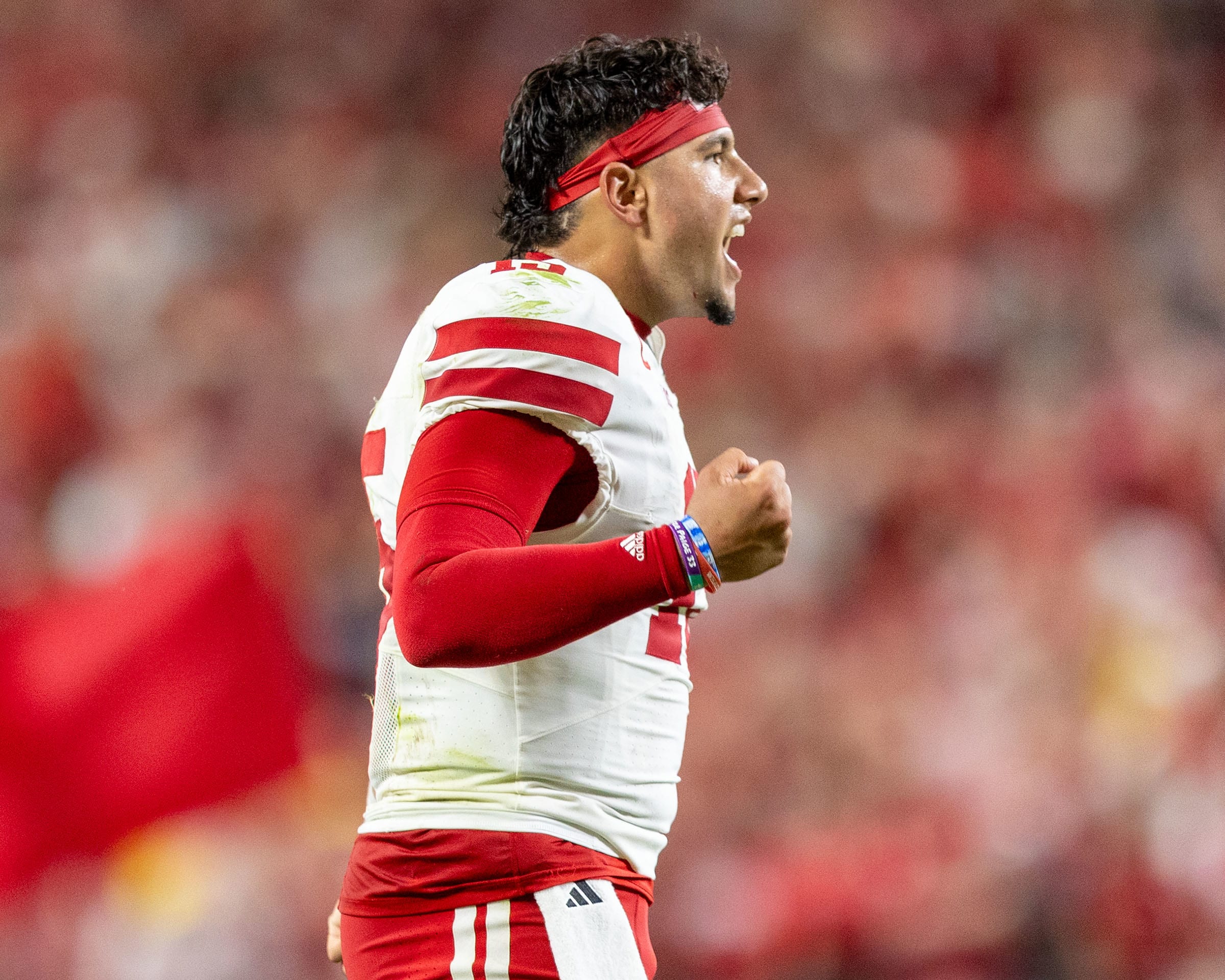 Nebraska quarterback Dylan Raiola hollers out to teammates after the Huskers took a 20-10 lead against Cincinnati.