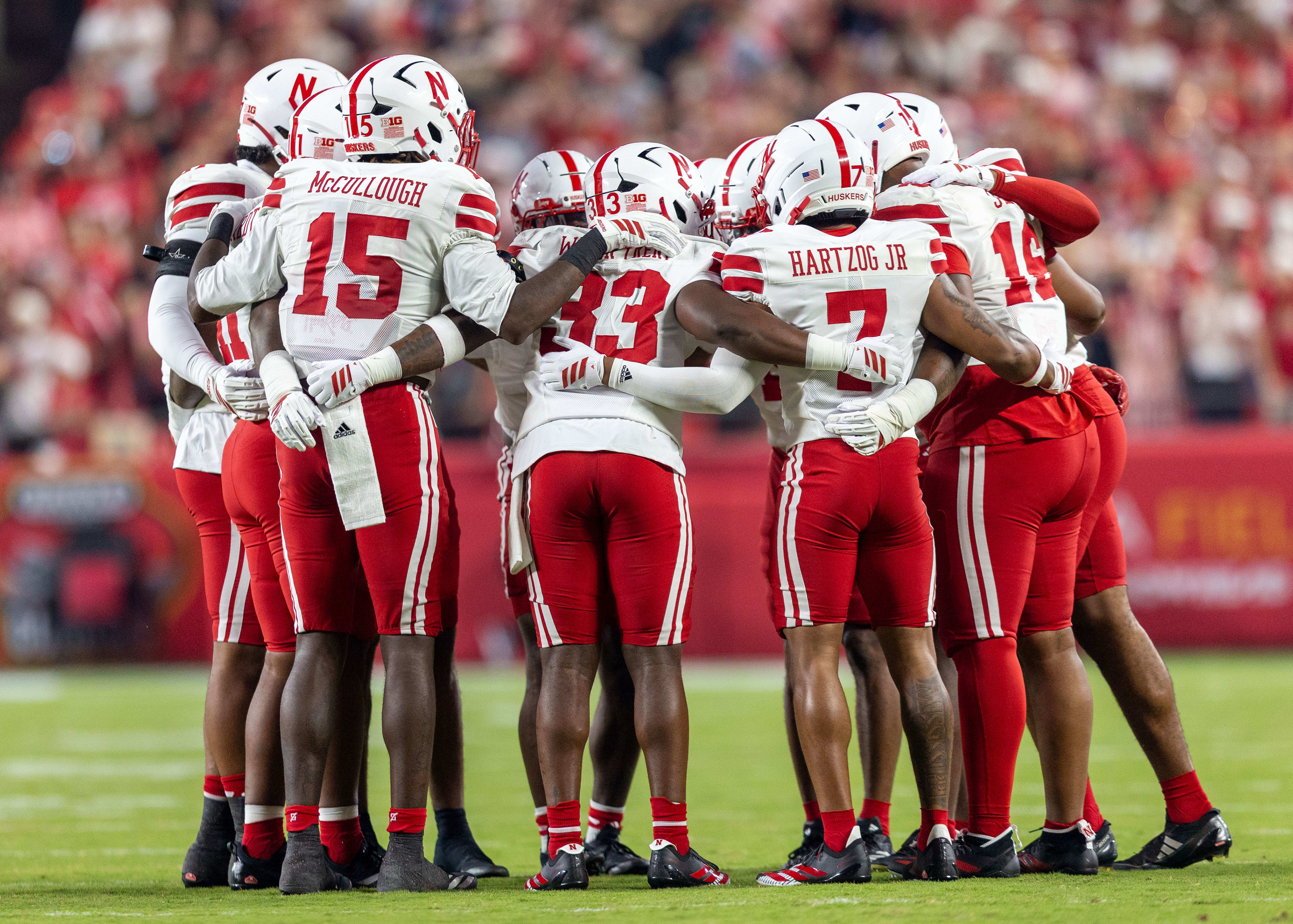 The Nebraska Cornhuskers defense huddles up before the start of the Nebraska-Cincinnati game.