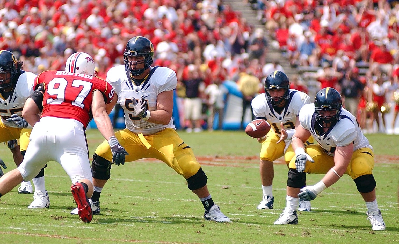 Alex Mack, right, snaps the ball 