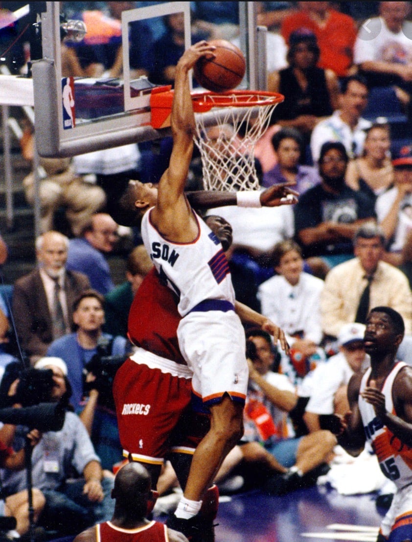 Kevin Johnson dunks over Hakeem Olajuwon