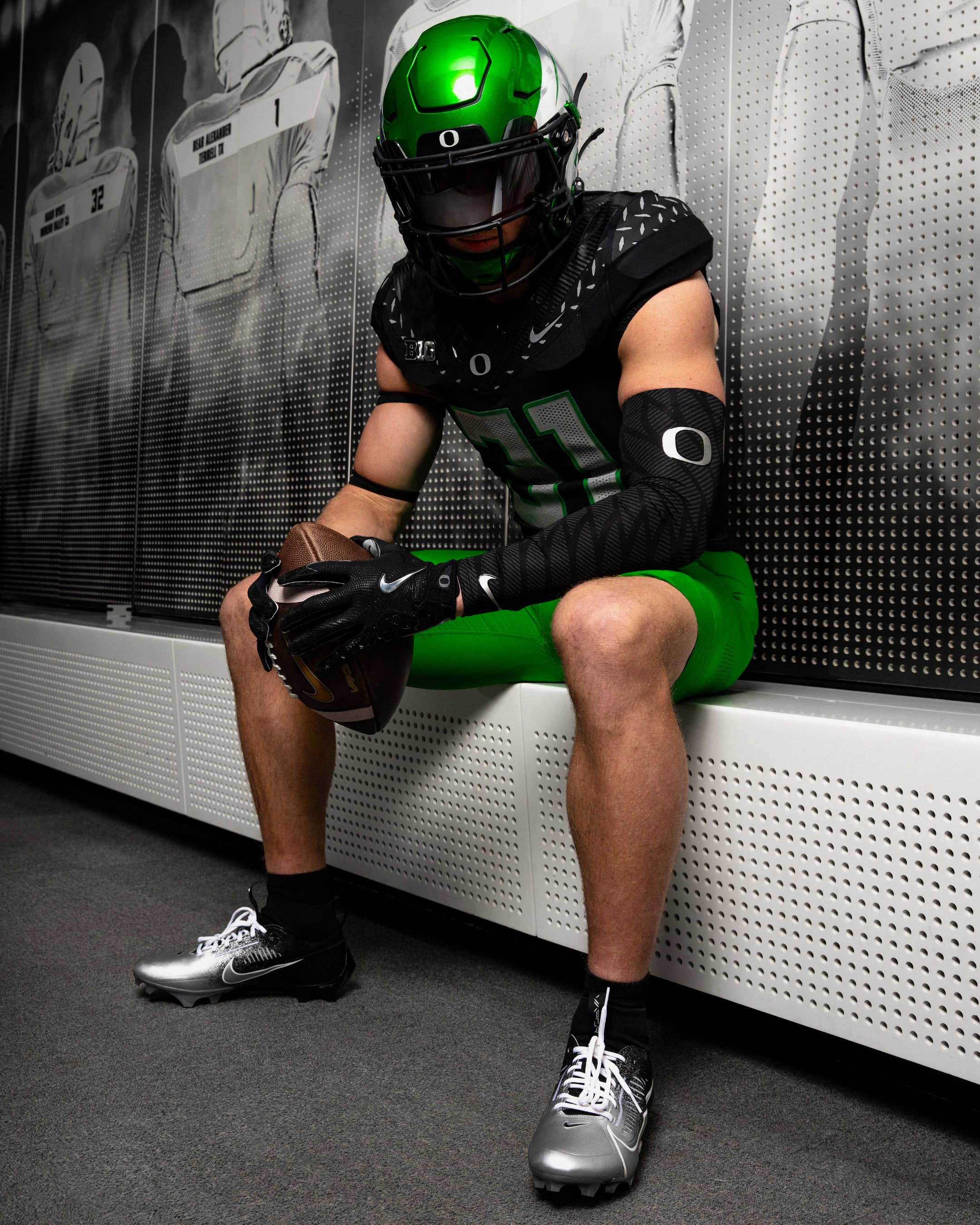 Dillon Thieneman models Oregon Duck Football's uniform combination for their game against the Indiana Hoosiers.