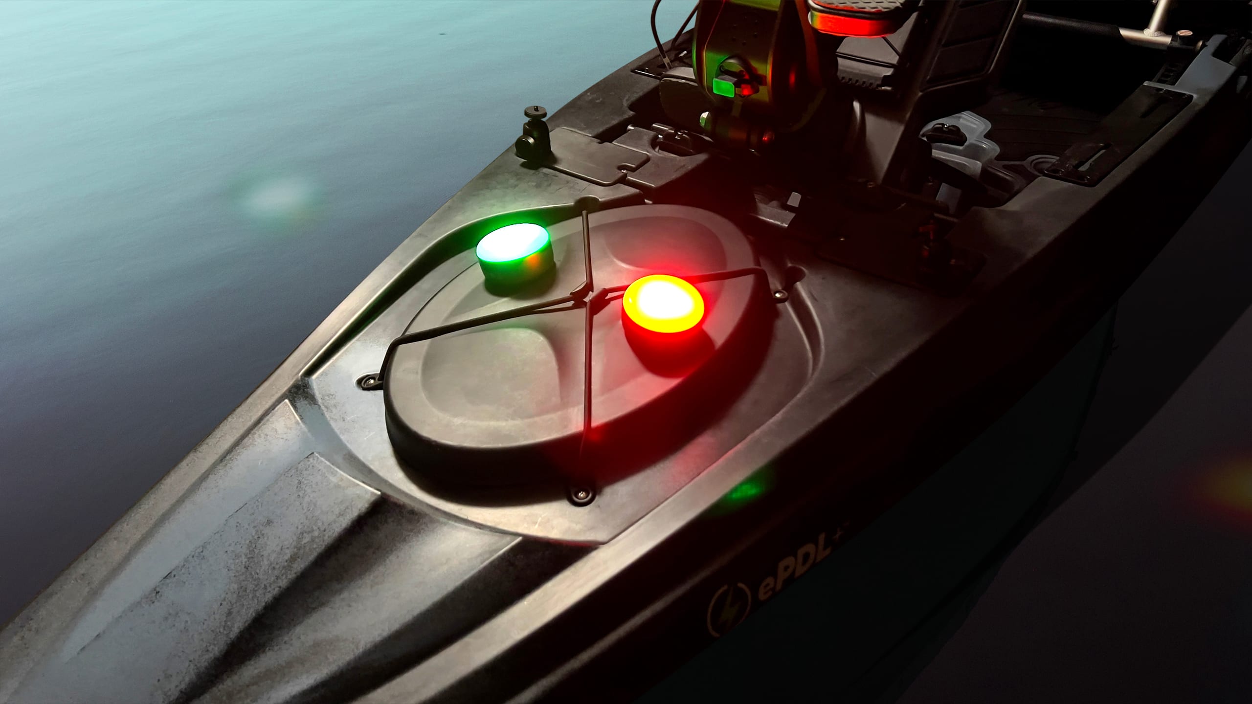 This kayak is using two lights set to red and green as a navigation beacon