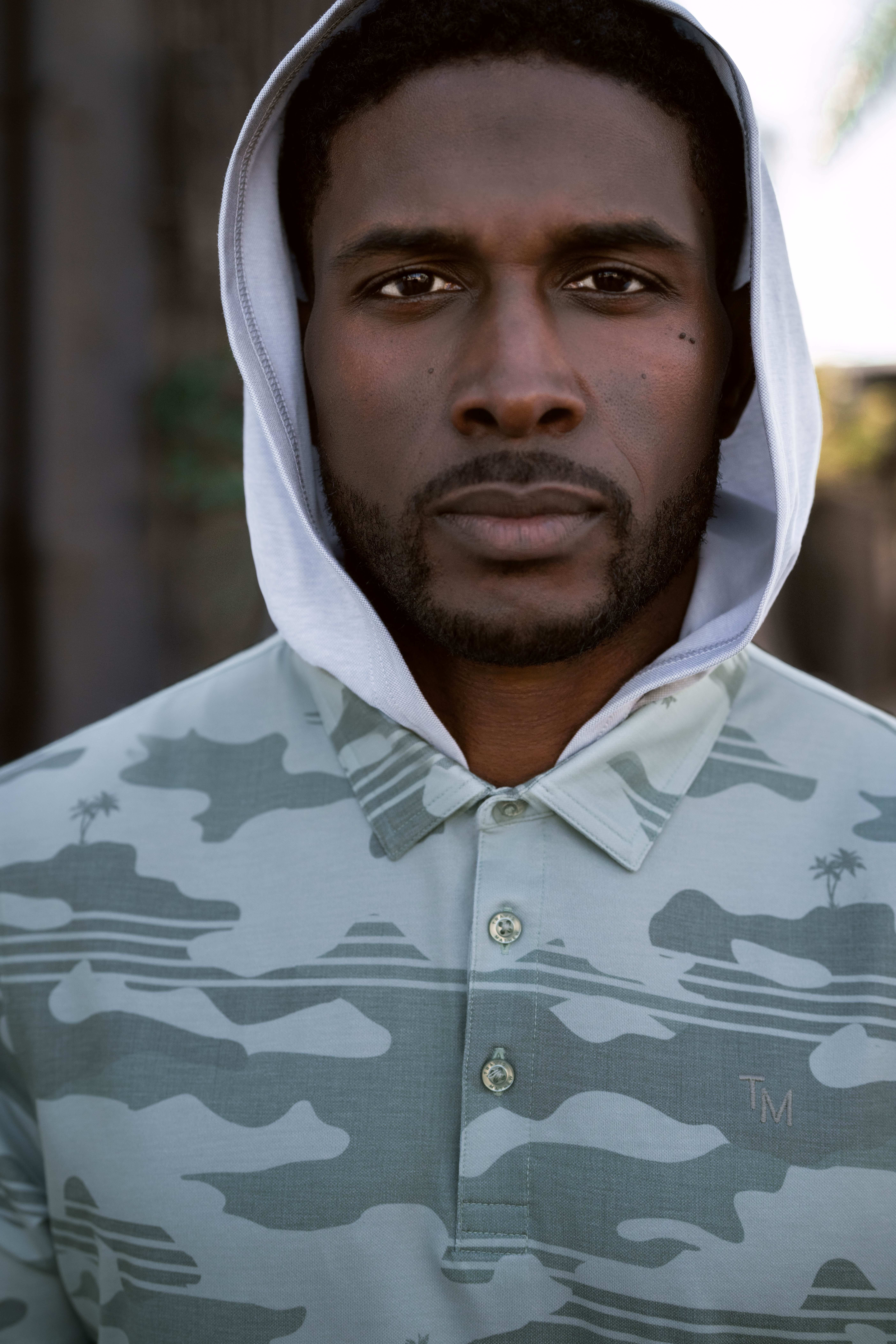 Reggie Bush models golf apparel.