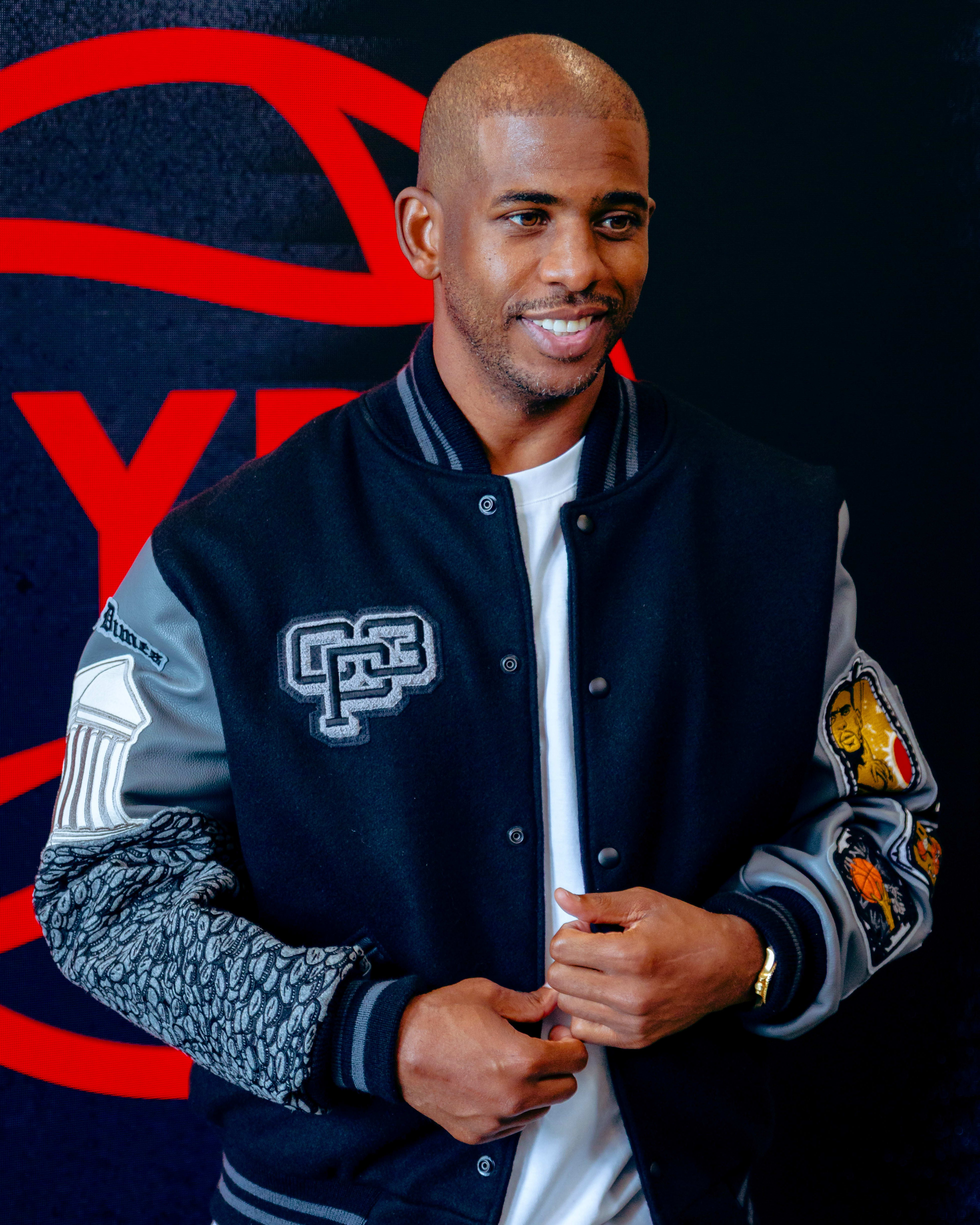 Chris Paul models a Jordan Brand jacket.