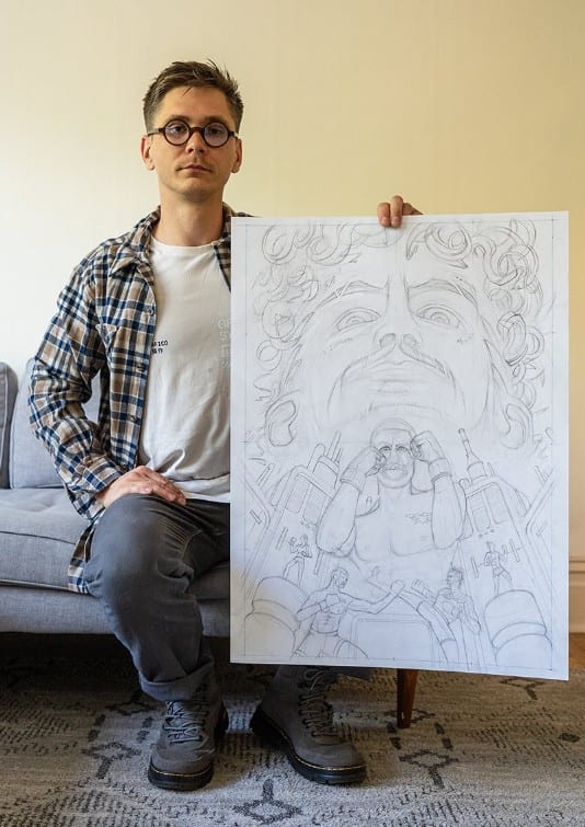 Ben Konkol holding up his UFC 316 artist series poster sketch