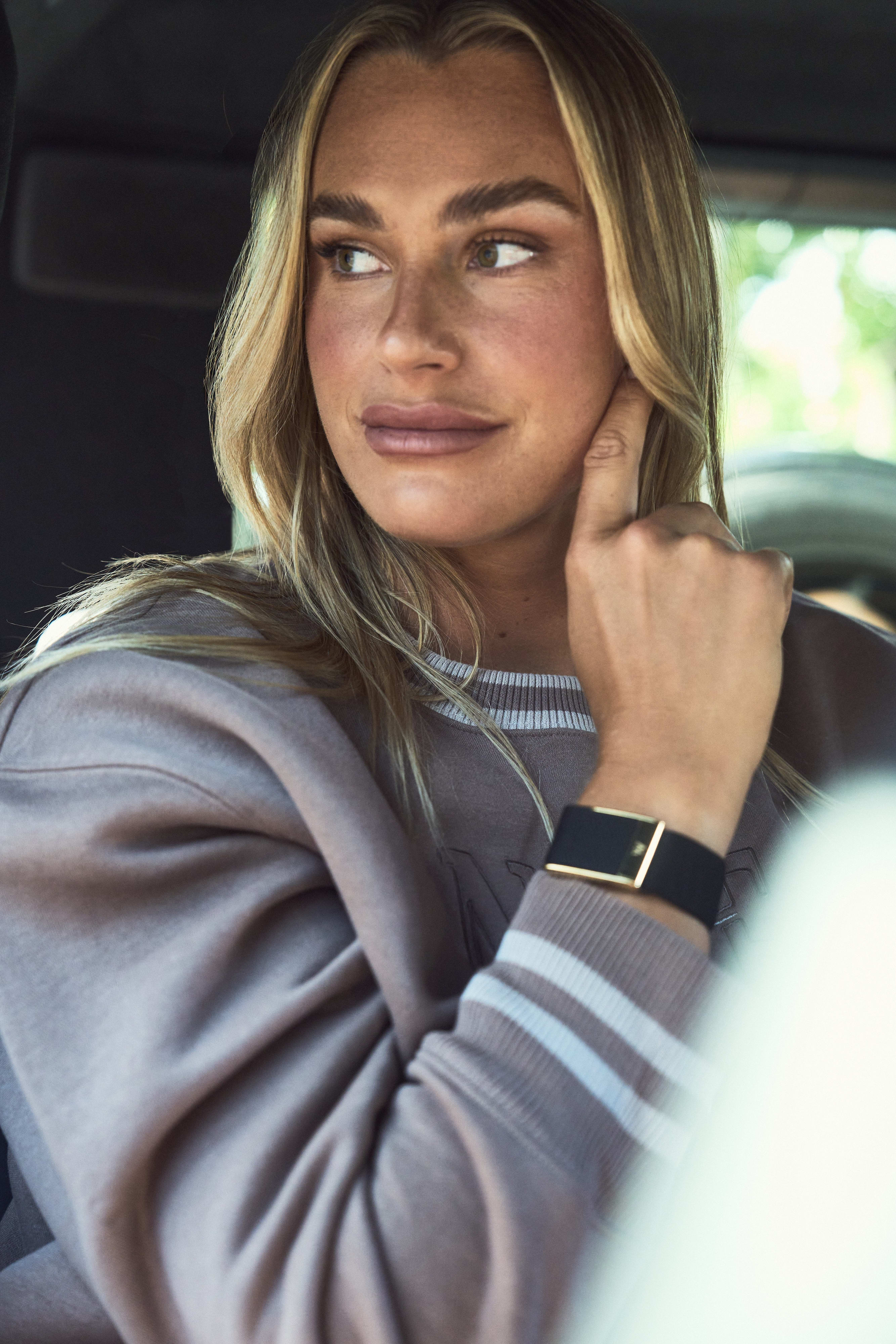 Aryna Sabalenka models a WHOOP watch.