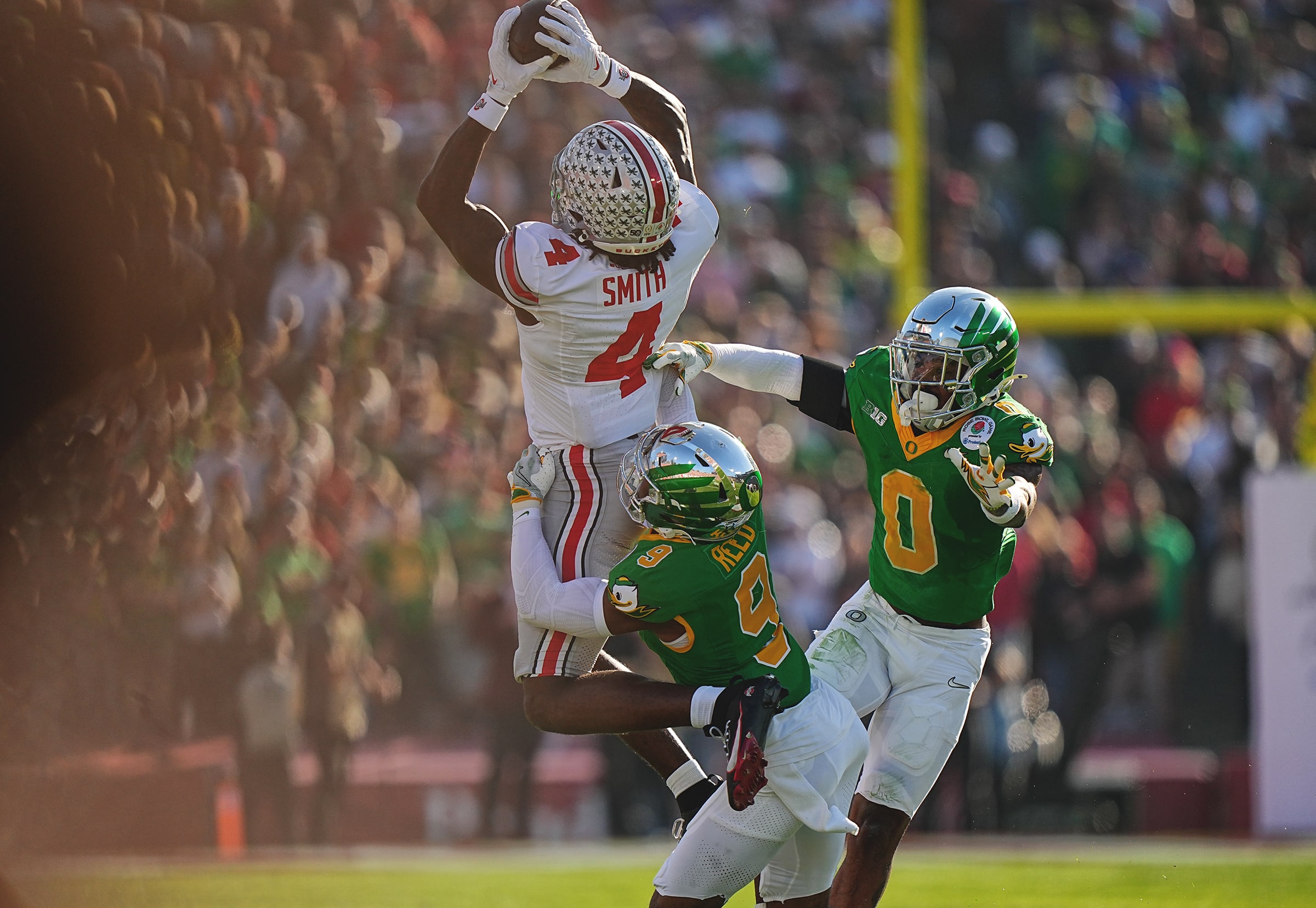 Ohio State Buckeyes wide receiver Jeremiah Smith leaps for a catch against the Oregon Ducks in the Rose Bowl.