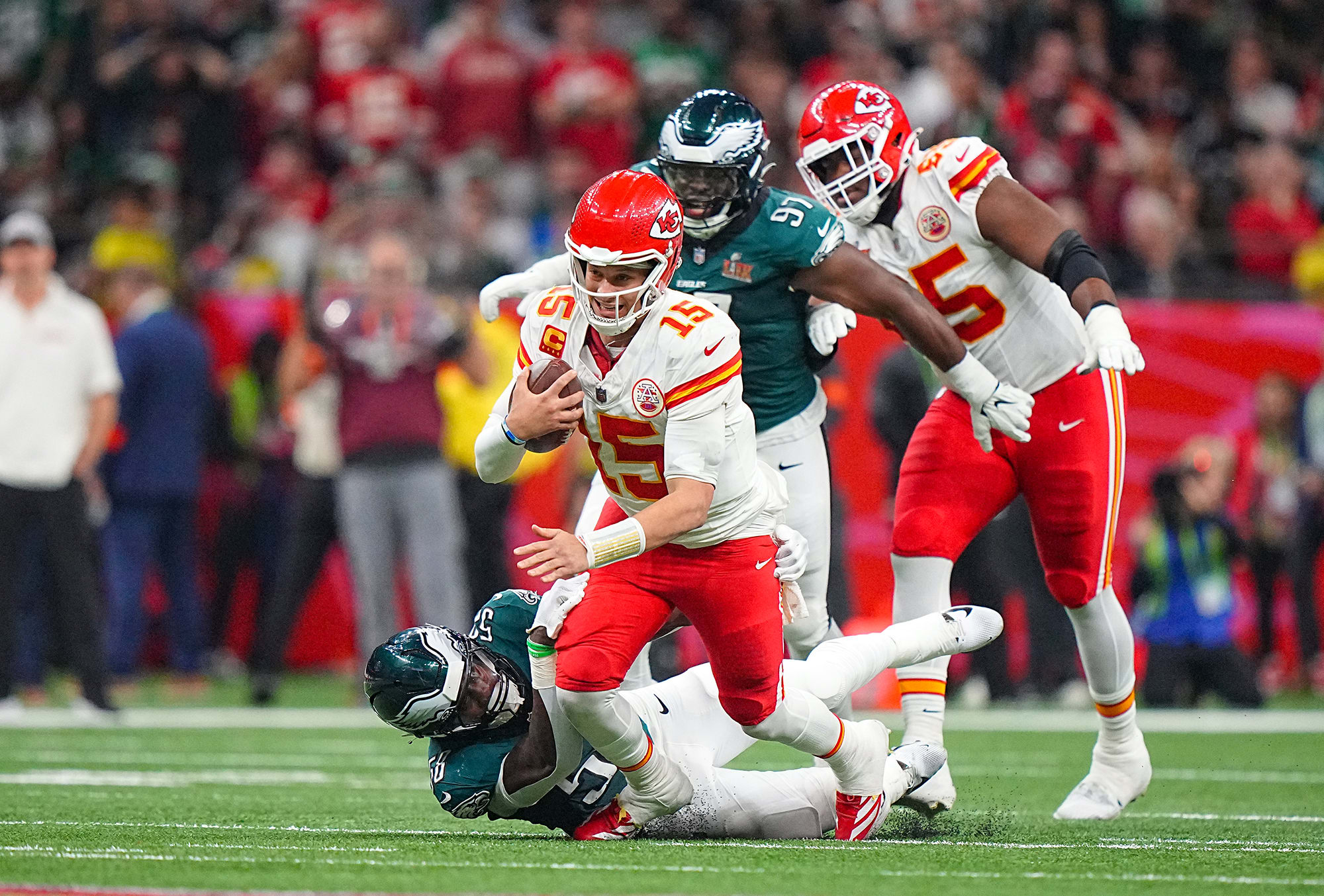 Patrick Mahomes being tackled.