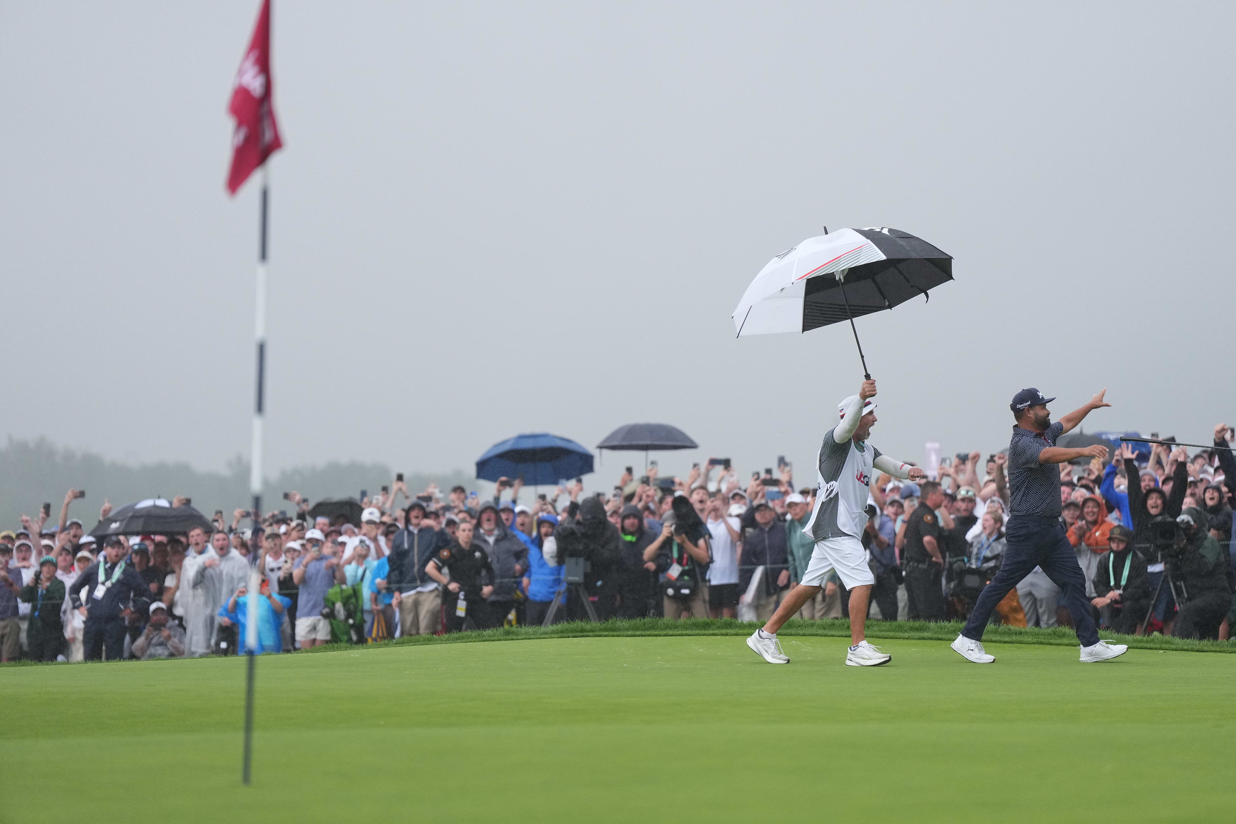 J.J. Spaun reacts after sinking a 64-foot putt 