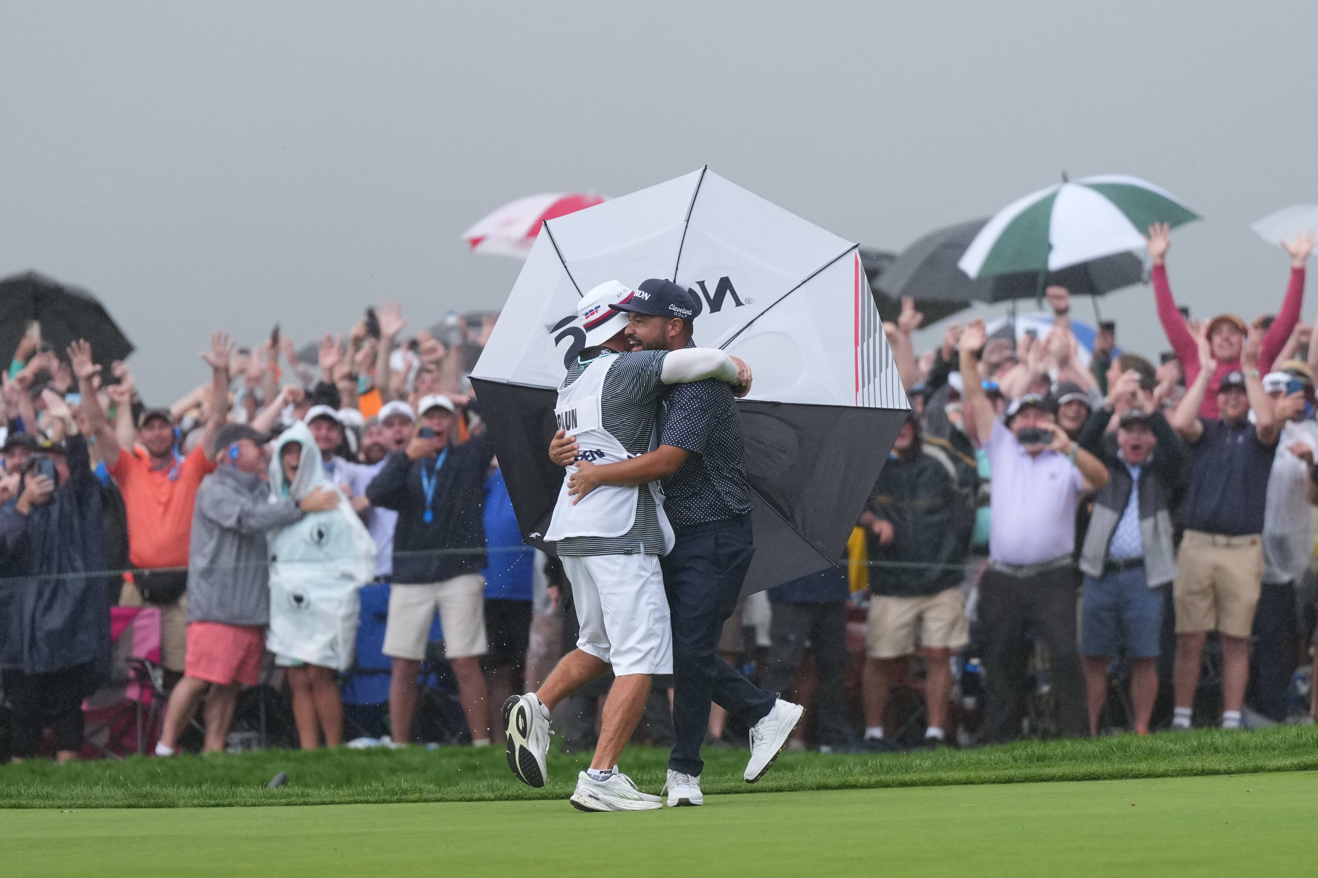 J.J. Spaun celebrates with this caddie after winning the U.S. Open.