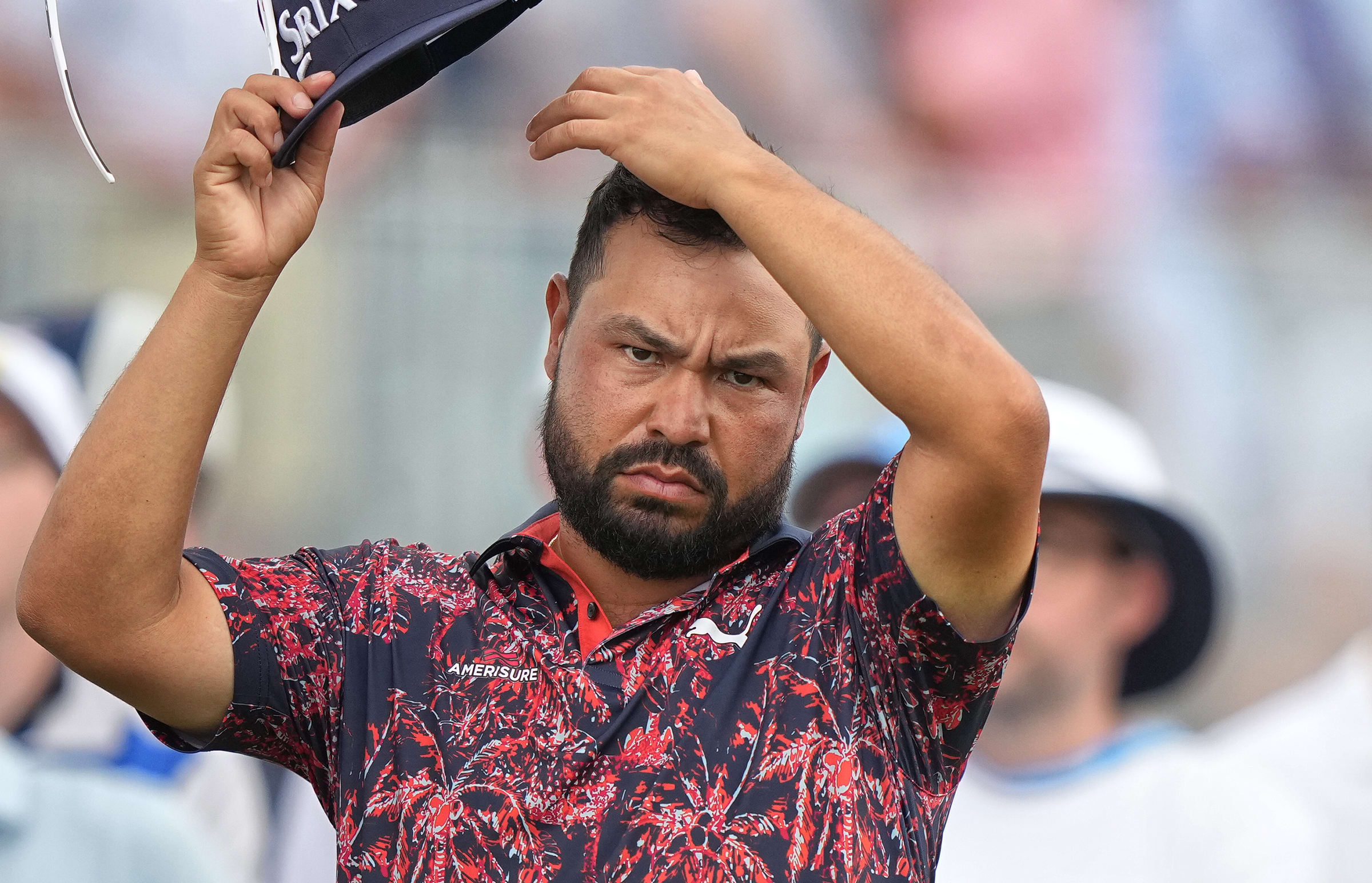 J.J. Spaun wipes his head during Friday's second round